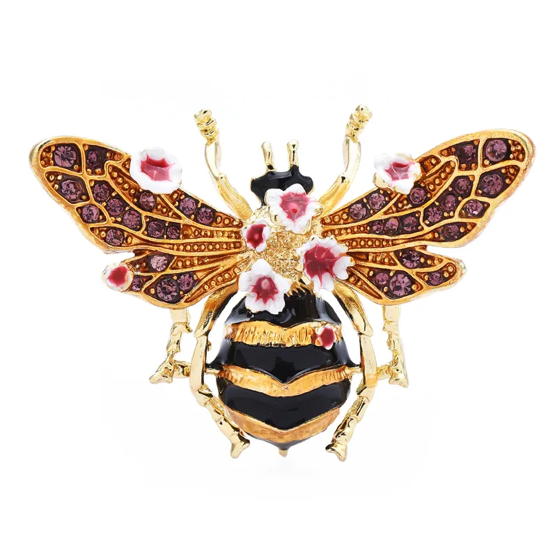Broche abeille dorée avec ailes violettes ornées de motifs floraux roses et blancs, corps rayé noir et or avec fleurs décoratives