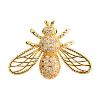 Broche abeille originale en métal doré avec corps orné de petits cristaux brillants et ailes ajourées