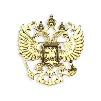 Broche aigle impérial dorée en métal avec motif à deux têtes couronnées et blason central