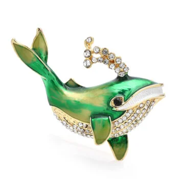 Broche baleine fantaisie en métal doré avec émail vert et strass blancs décorant la tête et le ventre