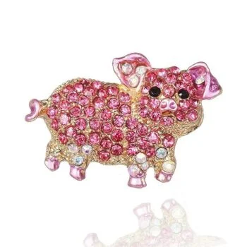 Broche cochon en métal doré ornée de strass roses et blancs, avec yeux noirs, motif cochon stylisé