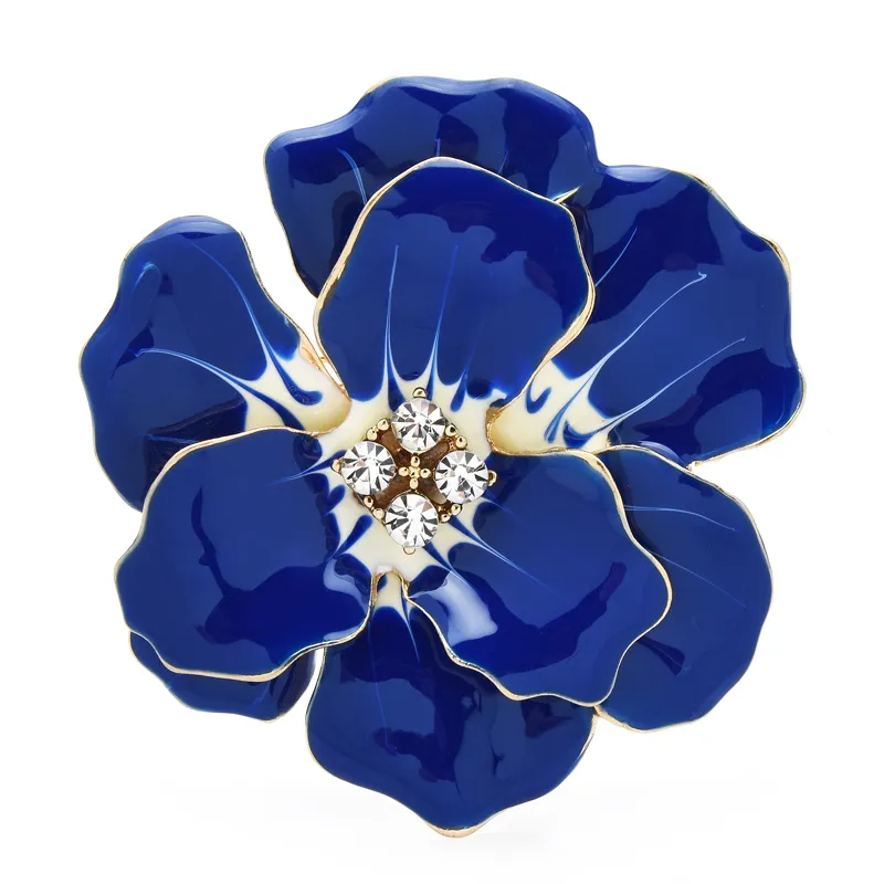 Broche fleurs rouges en métal émaillé bleu avec détails dorés et centre orné de strass brillants