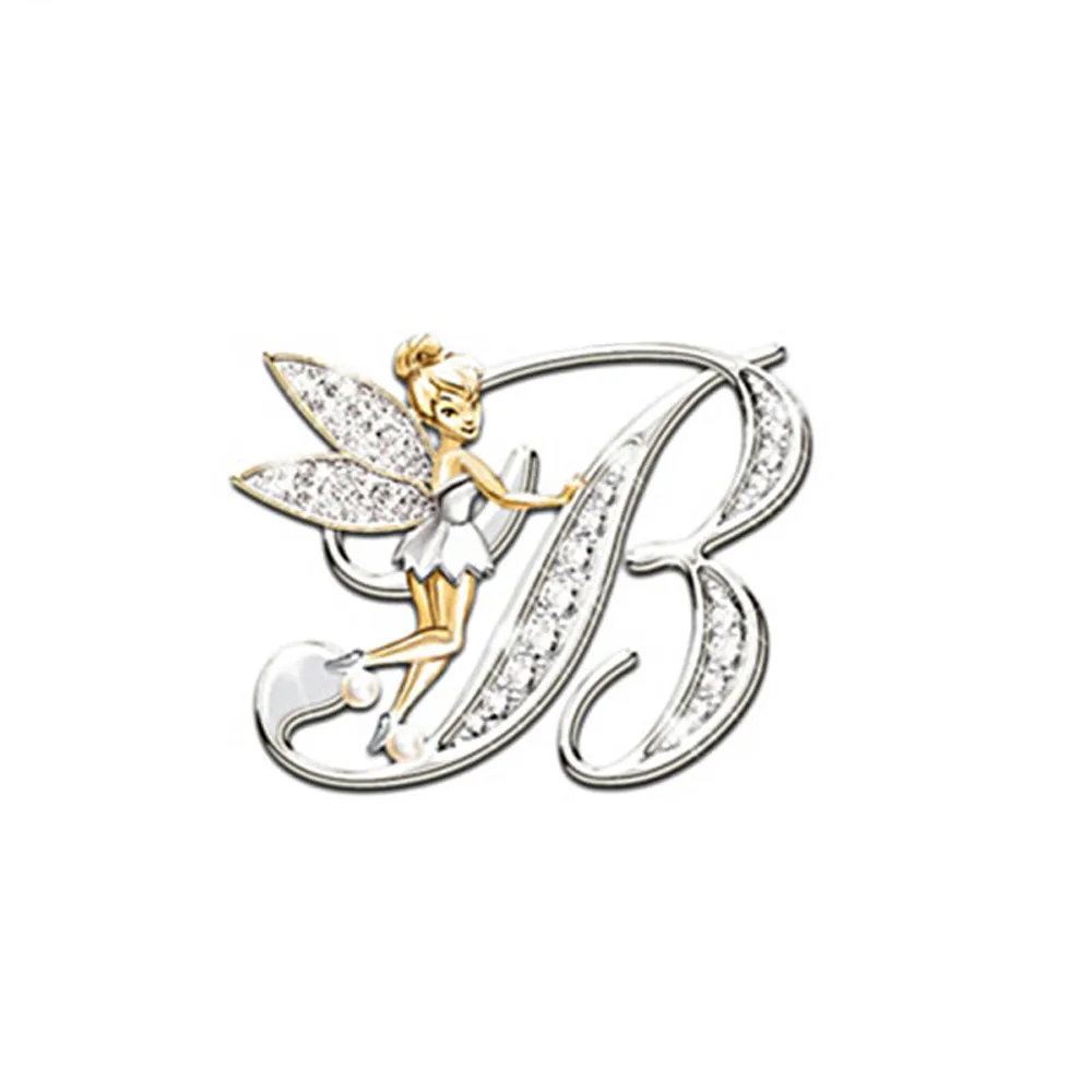 Broche grandes lettres en forme de lettre B argentée avec une fée dorée et ailes incrustées de strass