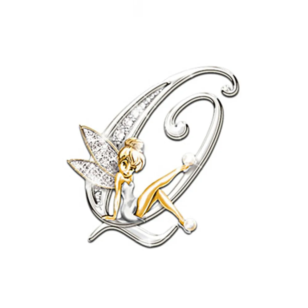 Broche grandes lettres en forme de lettre Q avec fée dorée assise et ailes argentées ornées de strass
