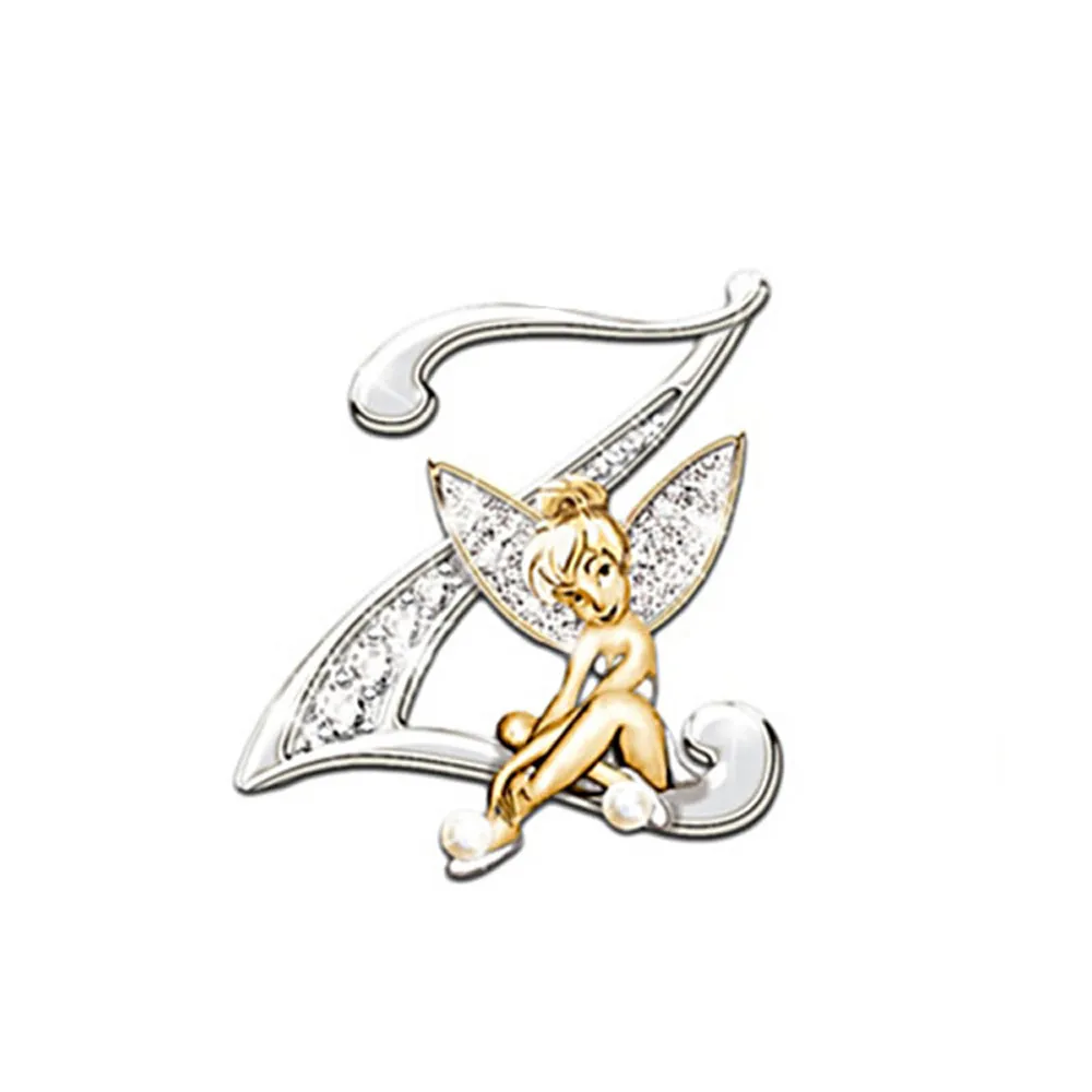 Broche Grandes Lettres en forme de lettre Z argentée avec fée dorée assise, détail soigné des ailes translucides