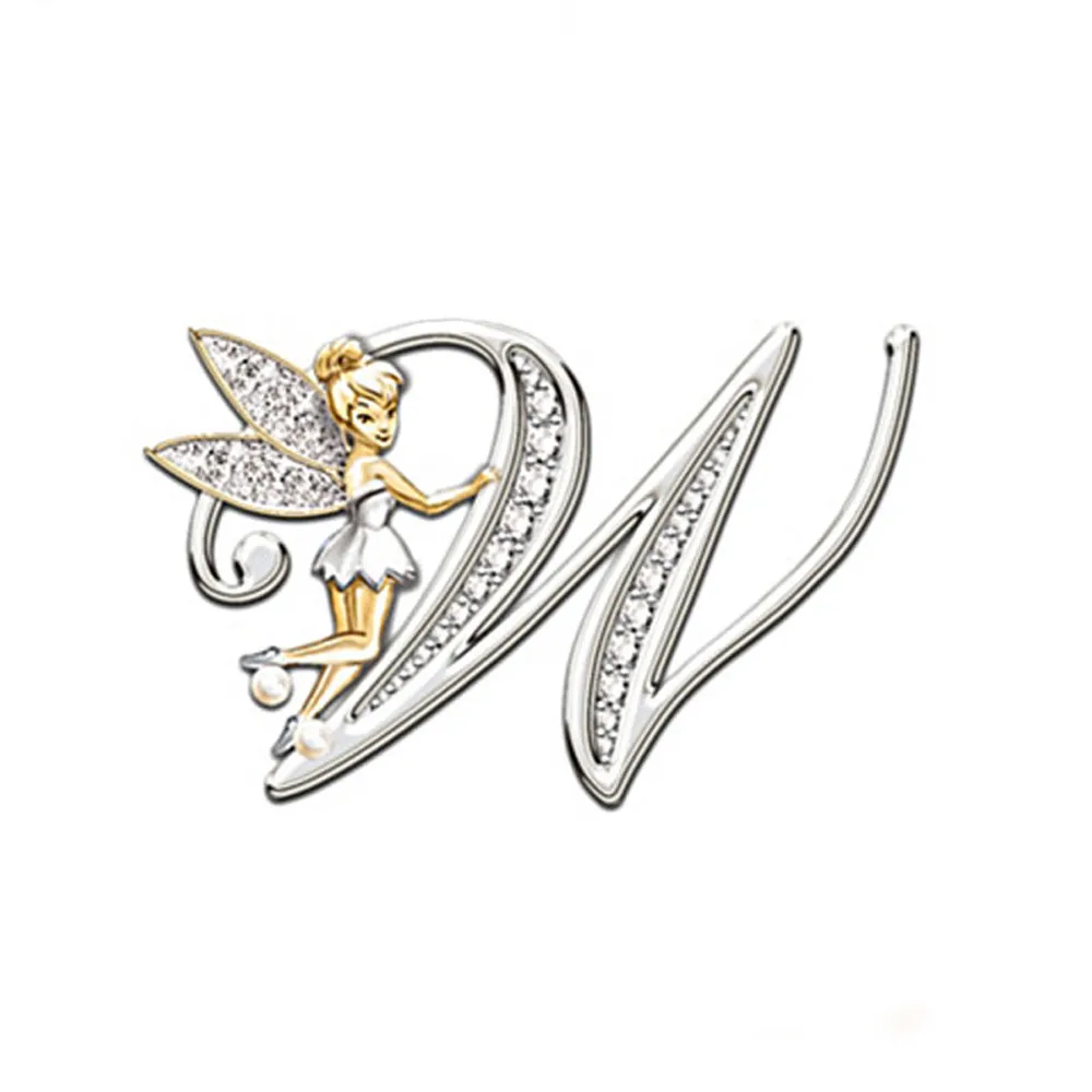 Broche grandes lettres modèle N en métal argenté avec fée dorée et ailes ornées de strass