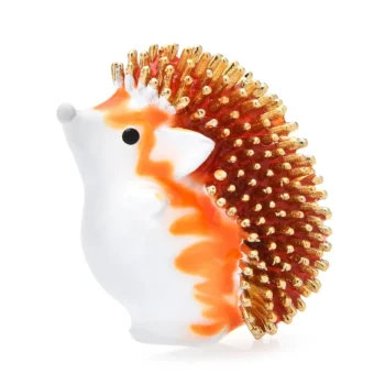 Broche hérisson blanche et orange avec piquants dorés en métal brillant
