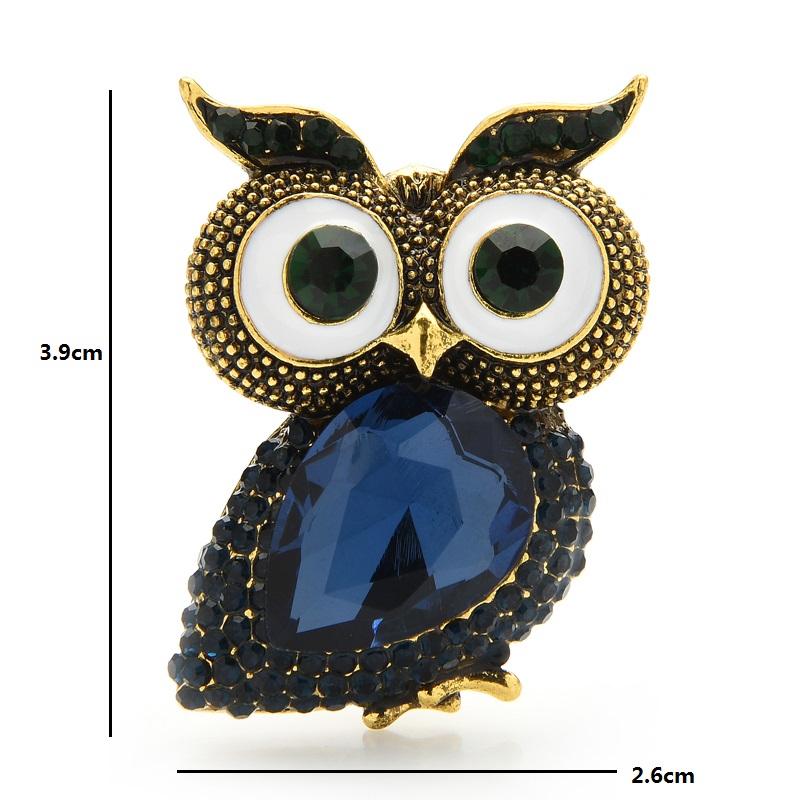 Broche hibou gros yeux en métal doré avec strass noirs et pierre bleue facettée en forme de goutte