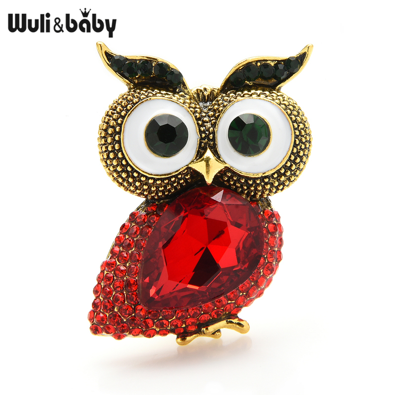 Broche hibou gros yeux en métal doré avec corps en pierre rouge facettée et yeux blancs et noirs