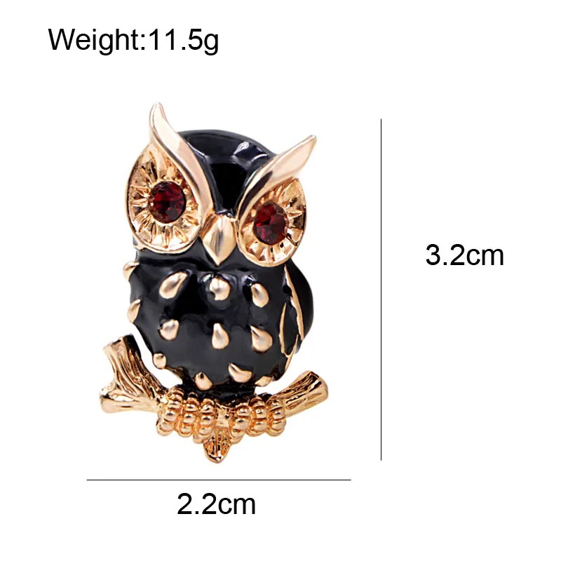 Broche hibou noir en métal doré avec strass rouges, détail soigné sur les plumes et les yeux, dimensions 3,2 cm x 2,2 cm