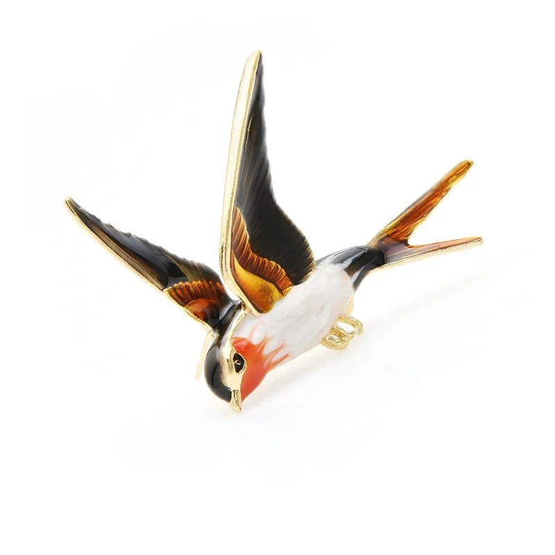 Broche hirondelle colorée en métal émaillé vue de côté avec ailes déployées