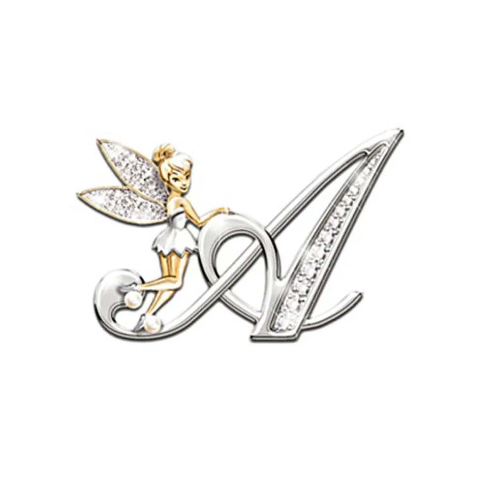 Broche grandes lettres forme lettre A en métal argenté avec détails strass et petite fée dorée posée sur la lettre