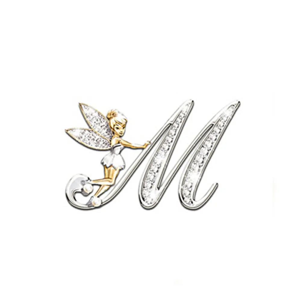 Broche grandes lettres en forme de lettre M avec fée dorée et ailes incrustées de strass
