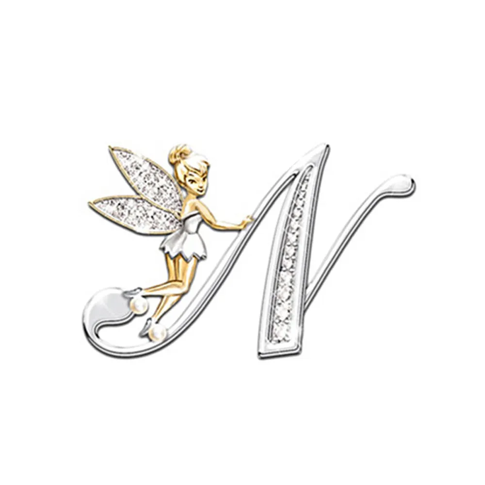 Broche grandes lettres lettre N en métal argenté avec strass et fée dorée posée sur la lettre