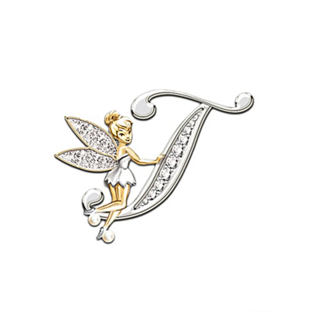 Broche grandes lettres en forme de lettre T argentée avec fée dorée aux ailes scintillantes et robe blanche