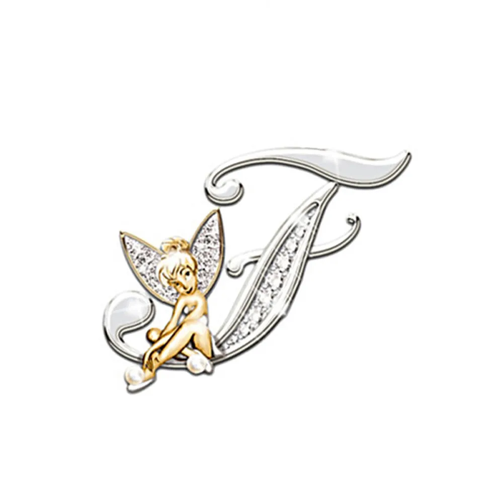 Broche grandes lettres en forme de lettre T avec fée dorée et argentée, détail soigné avec ailes incrustées de strass