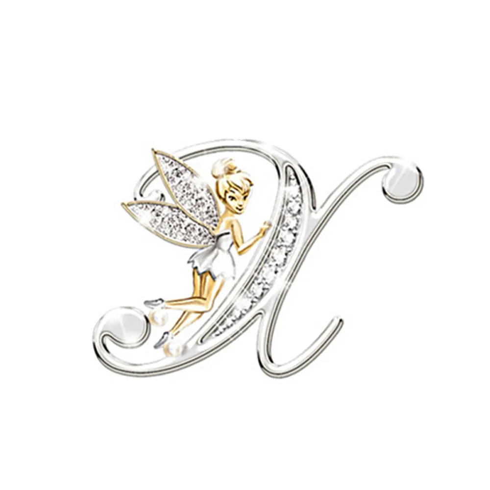 Broche grandes lettres en forme de lettre X argentée avec fée dorée et ailes incrustées de strass