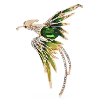 Broche Phoenix Strass dorée avec strass blancs et pierre verte en forme d'oiseau stylisé en vol