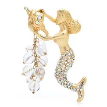 Broche sirène dorée avec queue ornée de strass irisés et pendentif feuilles transparentes