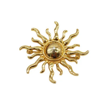 Broche Soleil dorée en métal avec rayons ondulés et centre bombé