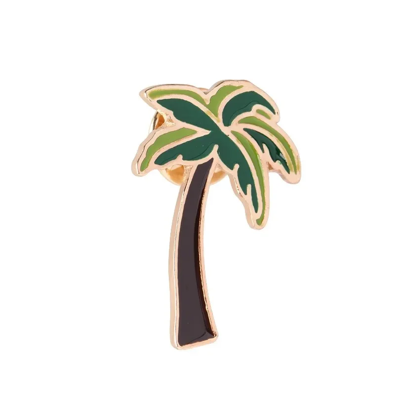 Pin's exotique en métal doré représentant un palmier avec feuilles vertes et tronc marron