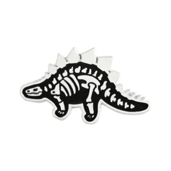 Pin's squelette de dinosaure noir et blanc en métal avec design stylisé