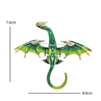 Broche Dragon Strass verte et dorée vue de face avec ailes déployées et détails en strass