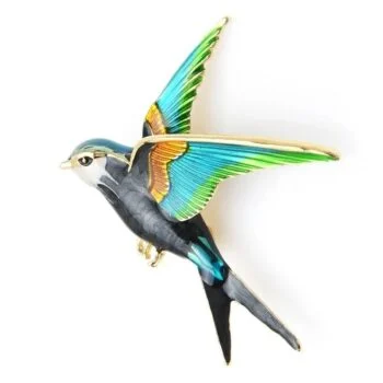 Broche hirondelle colorée en métal avec ailes déployées bleu vert et détails dorés