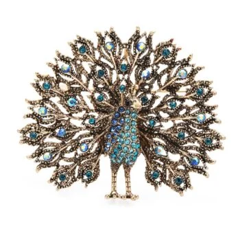 Broche paon en métal bronze avec strass bleus, motif détaillé de plumes déployées et finition soignée